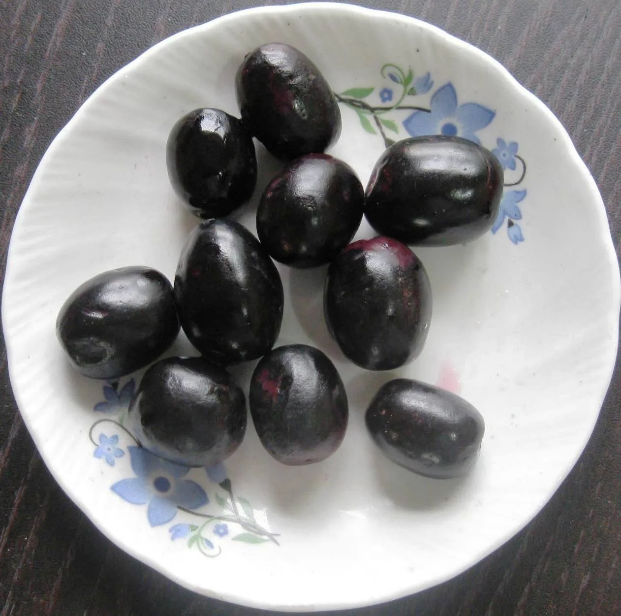 Freshly harvested jamun fruits sorted by hand